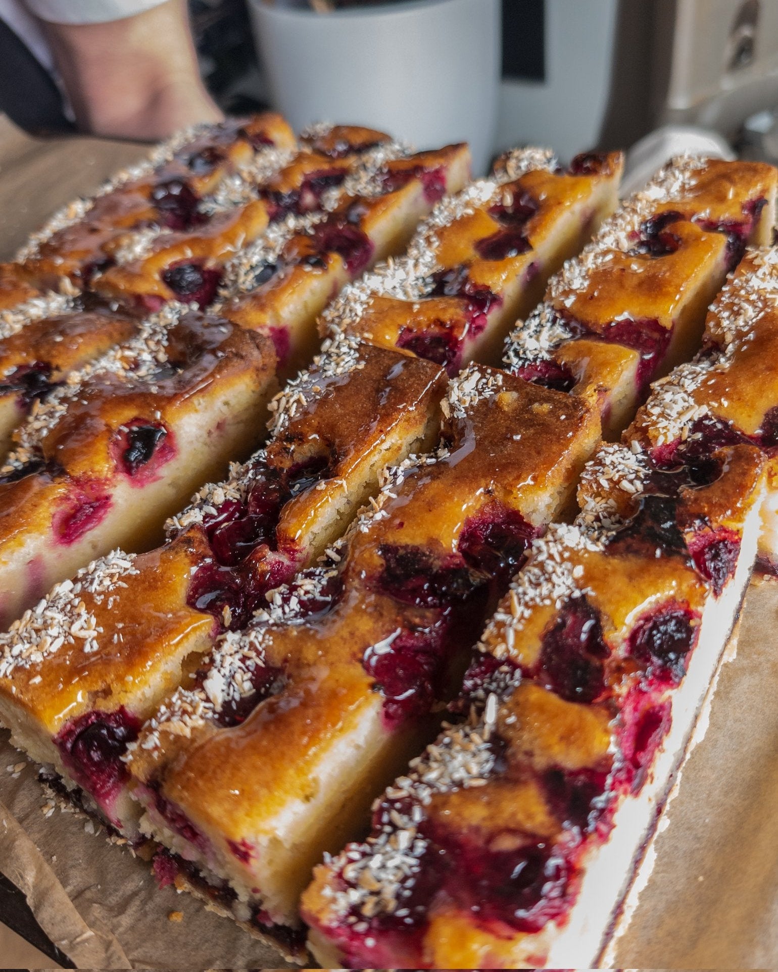 Baked dessert with berries on a cardboard tray